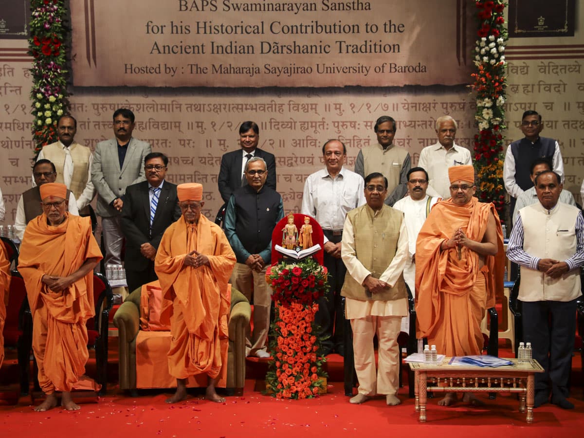 Senior sadhus, vice chancellors and university representatives on stage