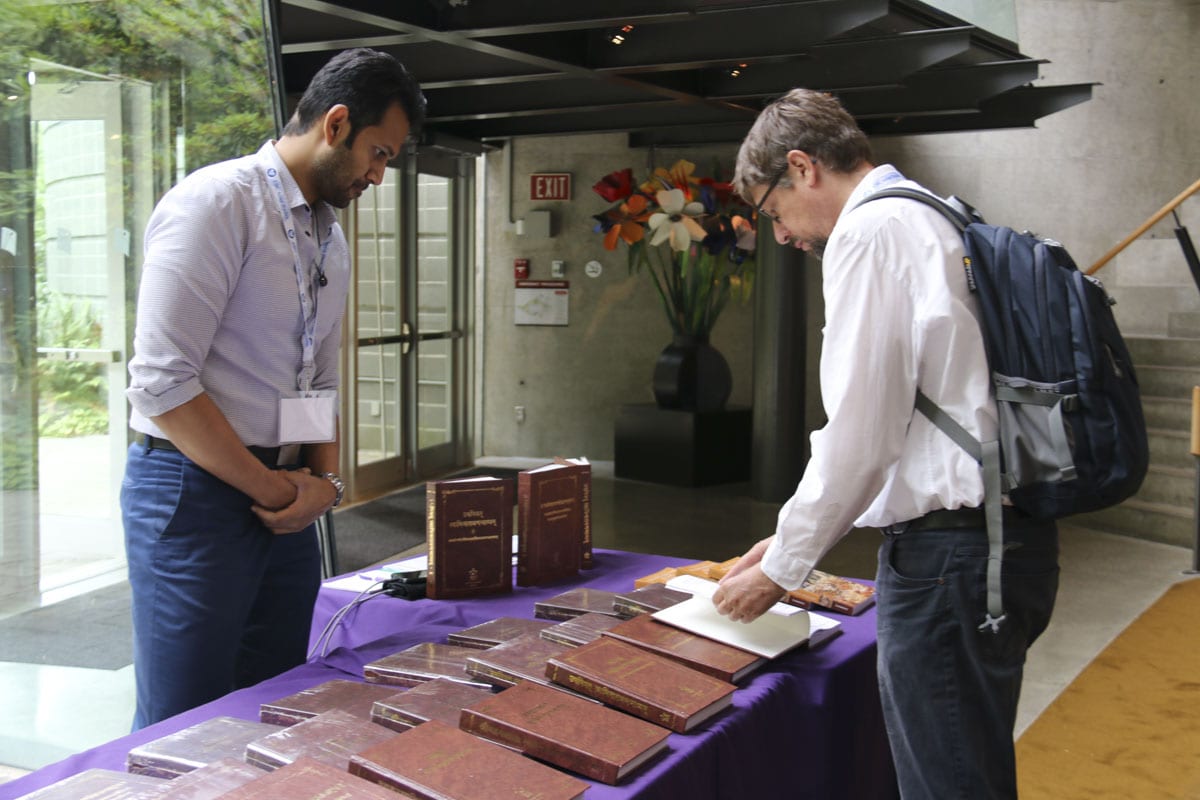 The 17th World Sanskrit Conference participants going through the Akshar-Purushottam Darshan
